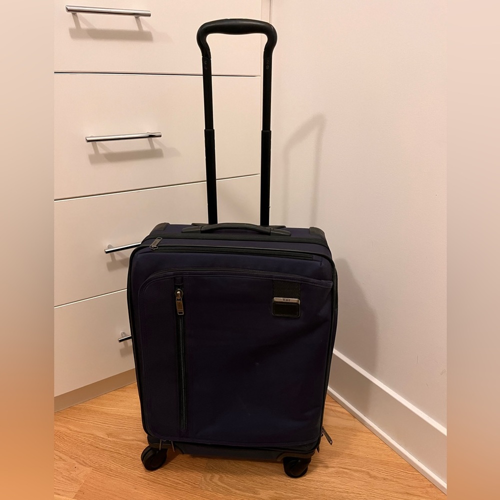 TUMI navy carry-on Rolling Suitcase